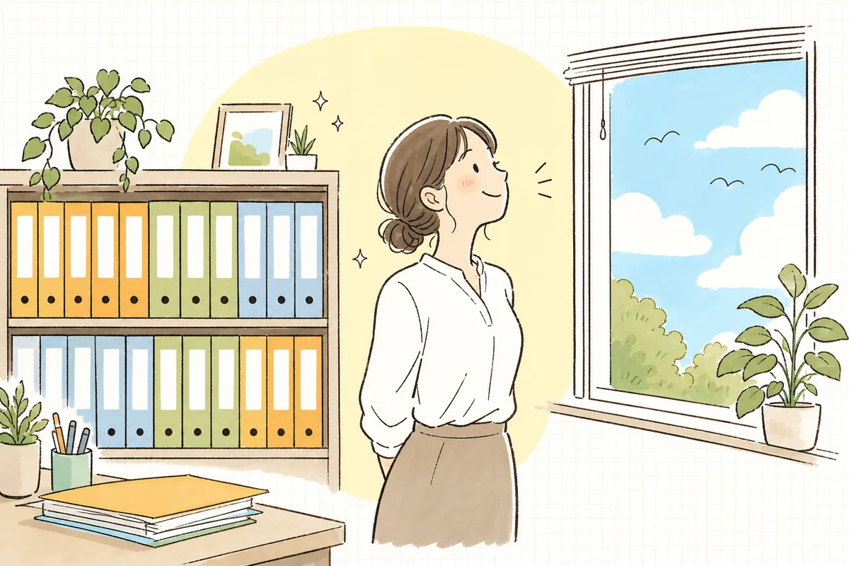 必要な書類を整え終え、窓の外の穏やかな空を見上げてほっとひと息つく介護事業所の事務担当者